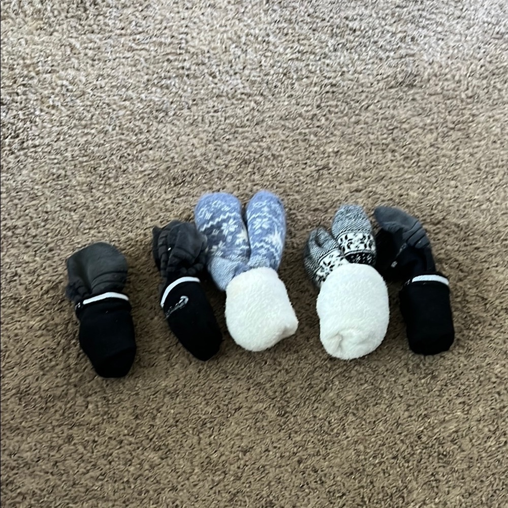 3 Nike socks and 2 fuzzy socks